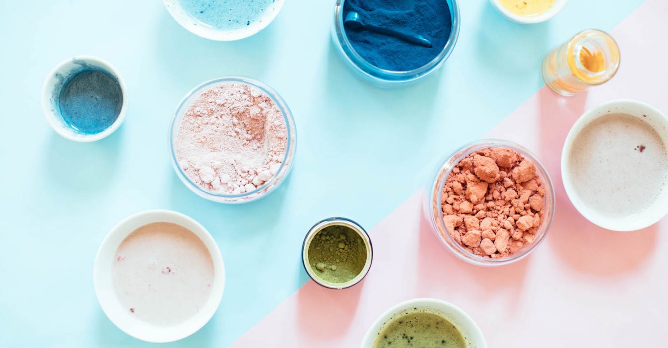 various powders and supplements in bowls shot overhead